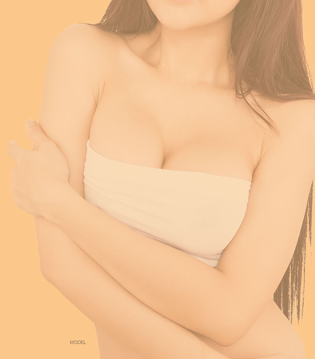 Woman in a white strapless bra