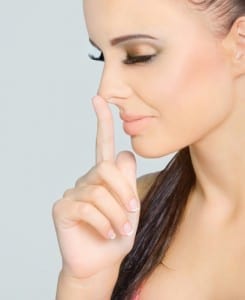 woman touching nose