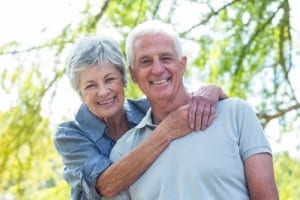 Mature couple posing for a photo in nature