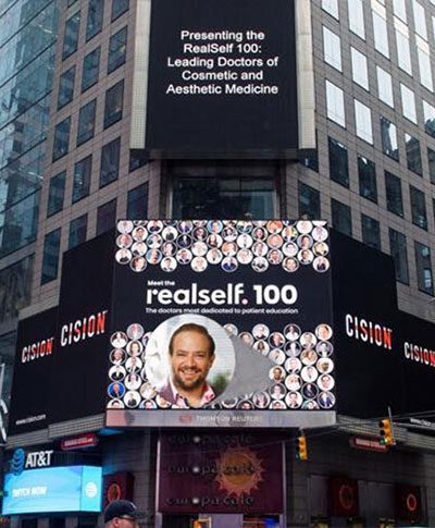 Dr Frank Agullo RealSelf 100: Leading Doctors of Cosmetic and Aesthetic Medicine - Billboard sign announcement in Time Square, NYC