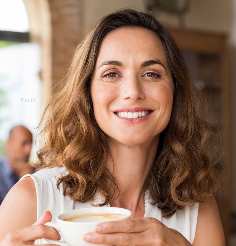 Mature woman drinking coffee