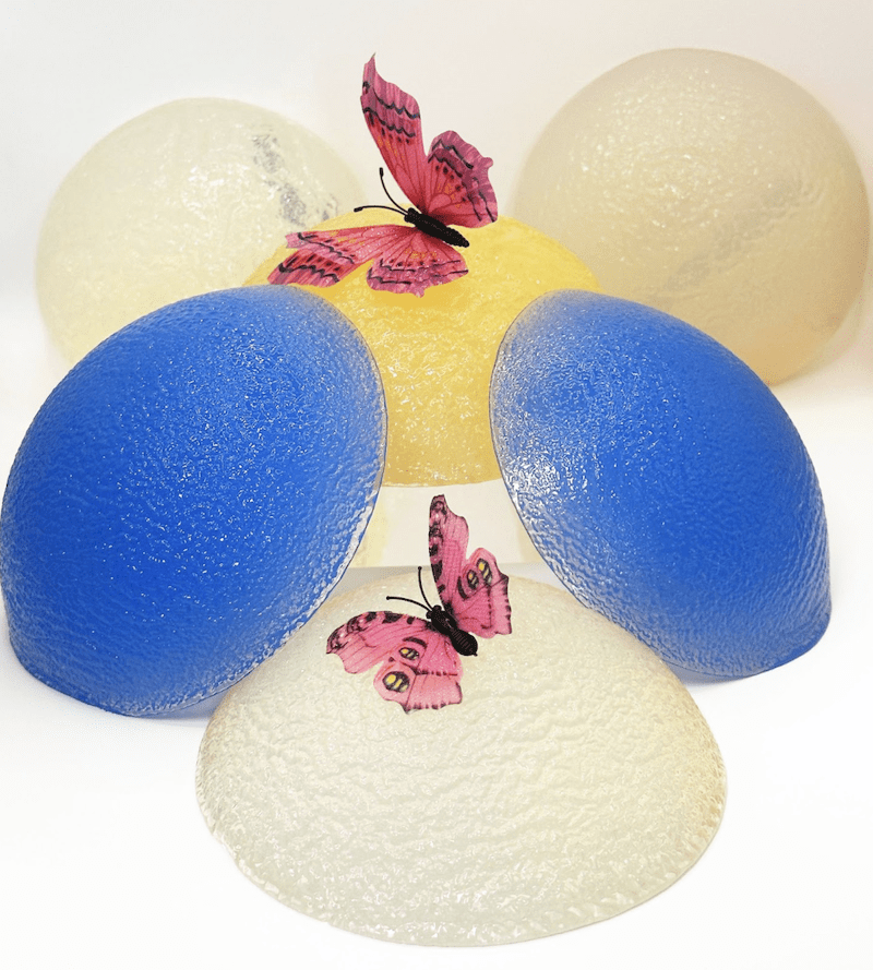Pile of butt implants with butterflies.