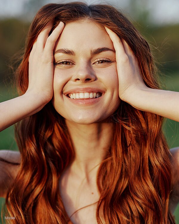 woman with wavy red hair