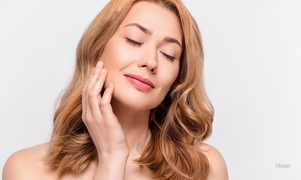 woman with her hands on her face